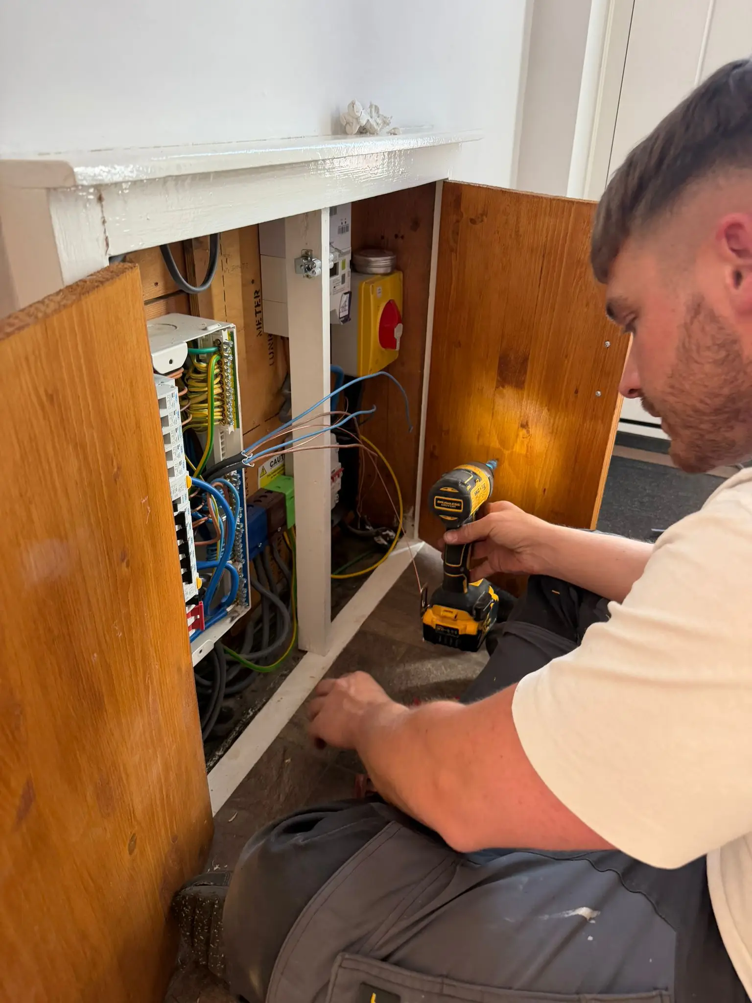 Jack Begley working on a consumer unit